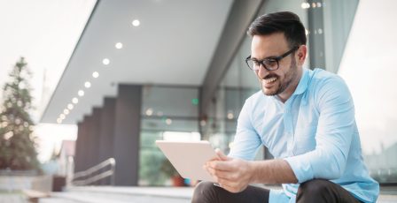 Man online banking on a tablet