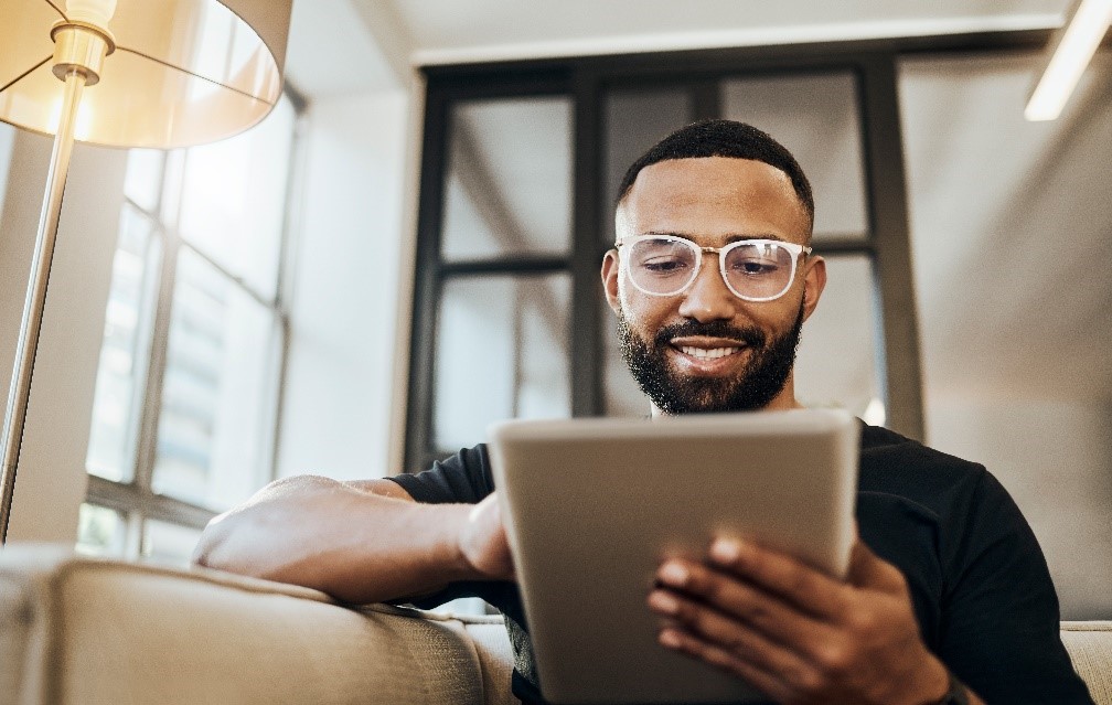 Man looking at his tablet