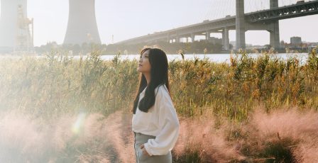 Woman looking out over a power station