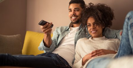 Young couple watching the television