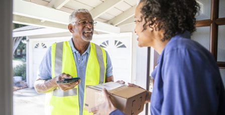 Delivery driver handing over parcel