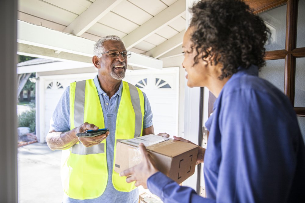 Delivery driver handing over parcel