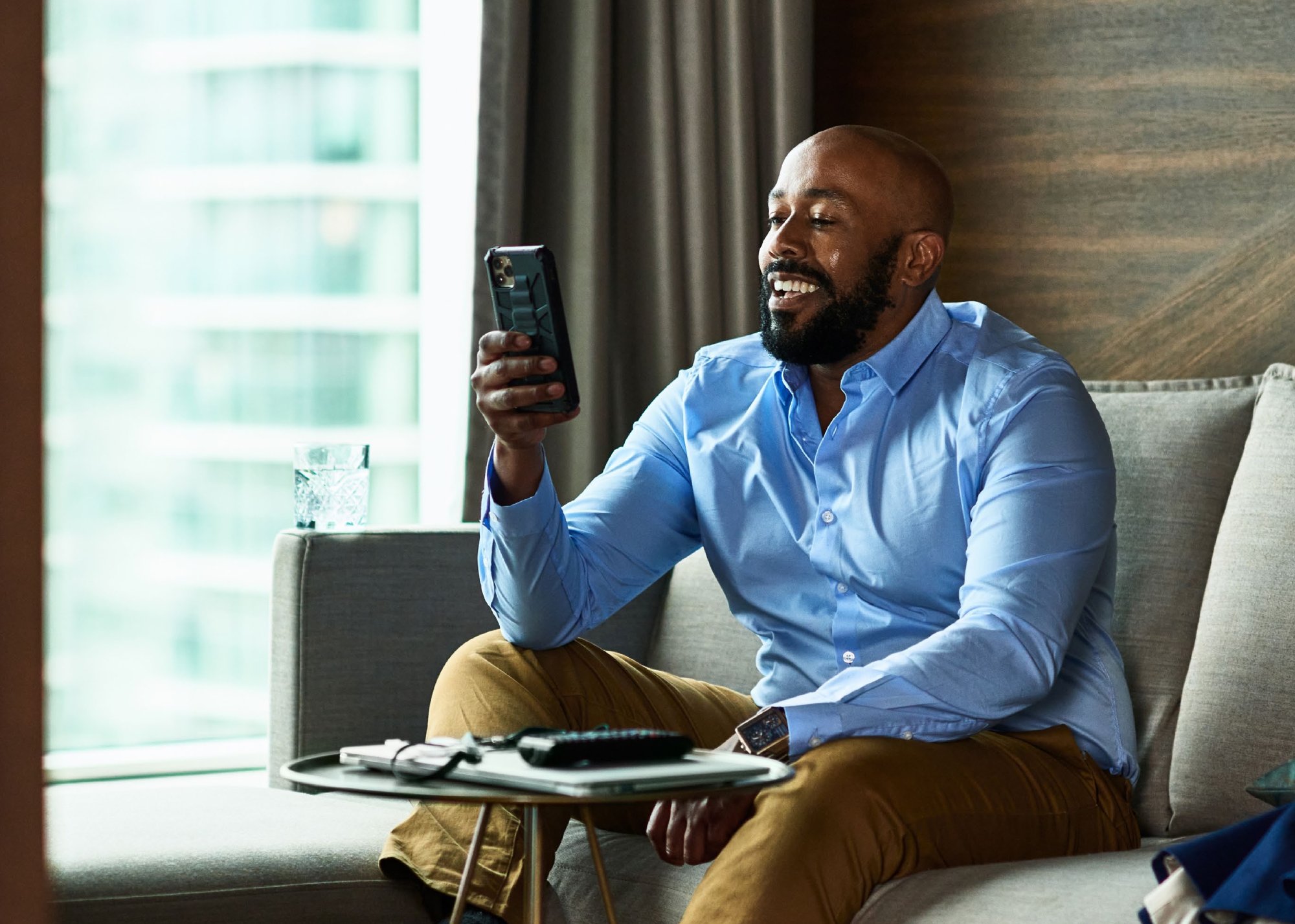 Man sitting in a Village Hotel room