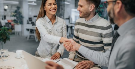 Small business owners agreeing a loan with a lender