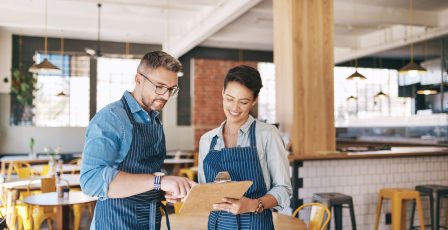Coffee shop owner onboarding a new recruit