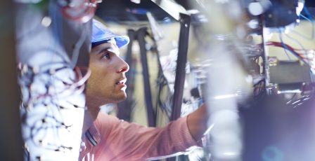 Telecommunications engineer performing tests