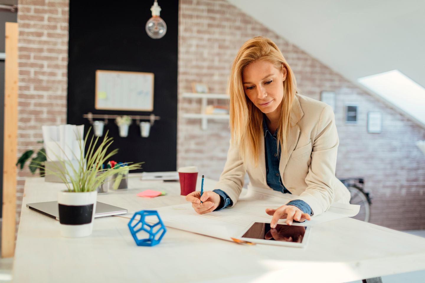 Woman completing an application in her home office