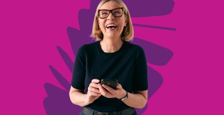 Woman smiling while browsing on phone