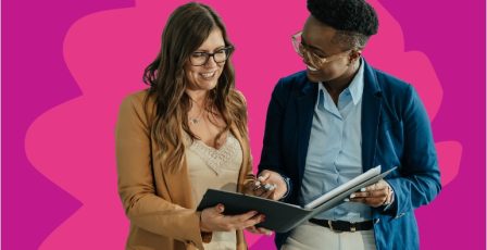 Two colleagues looking at documents