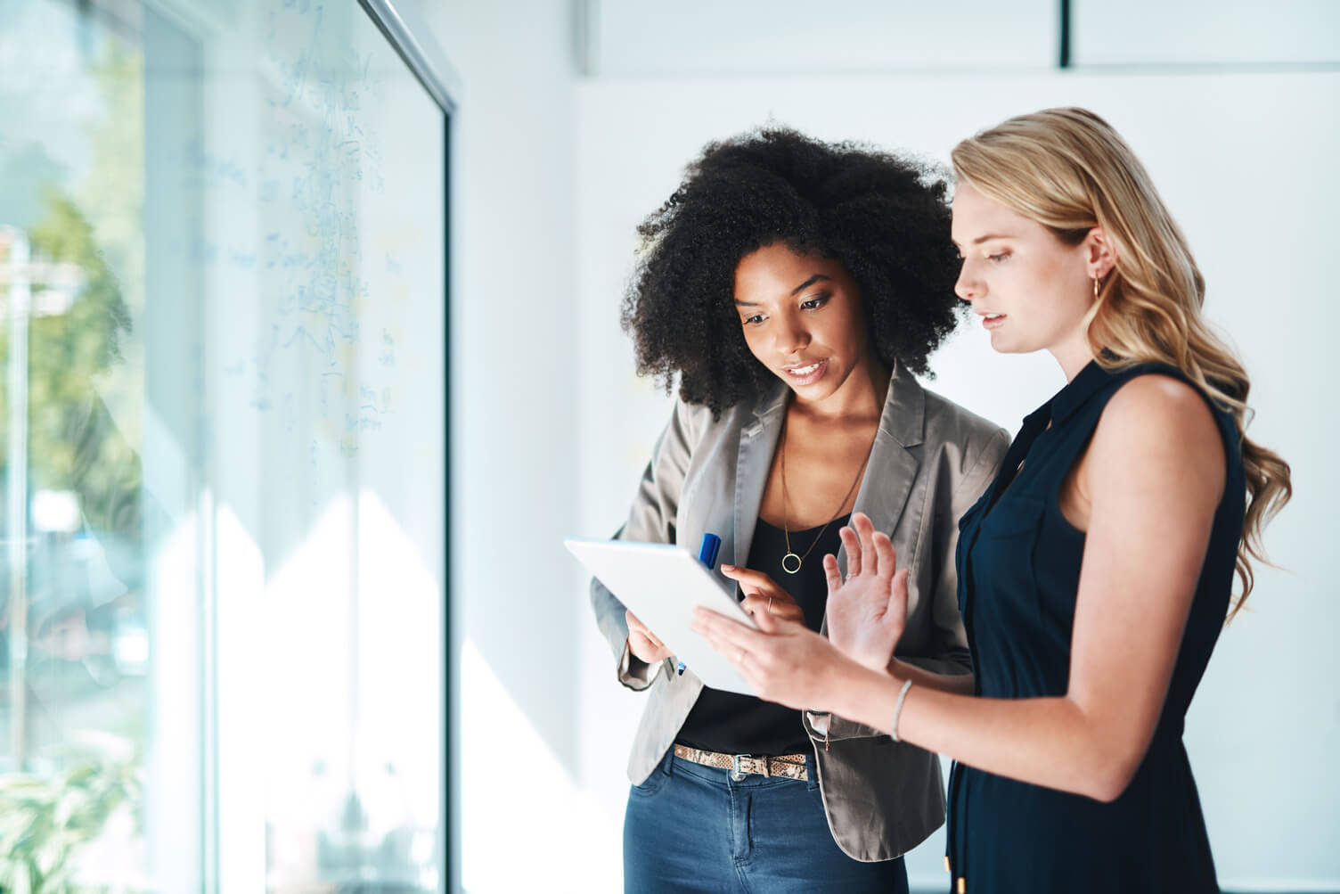 Two women discussing data