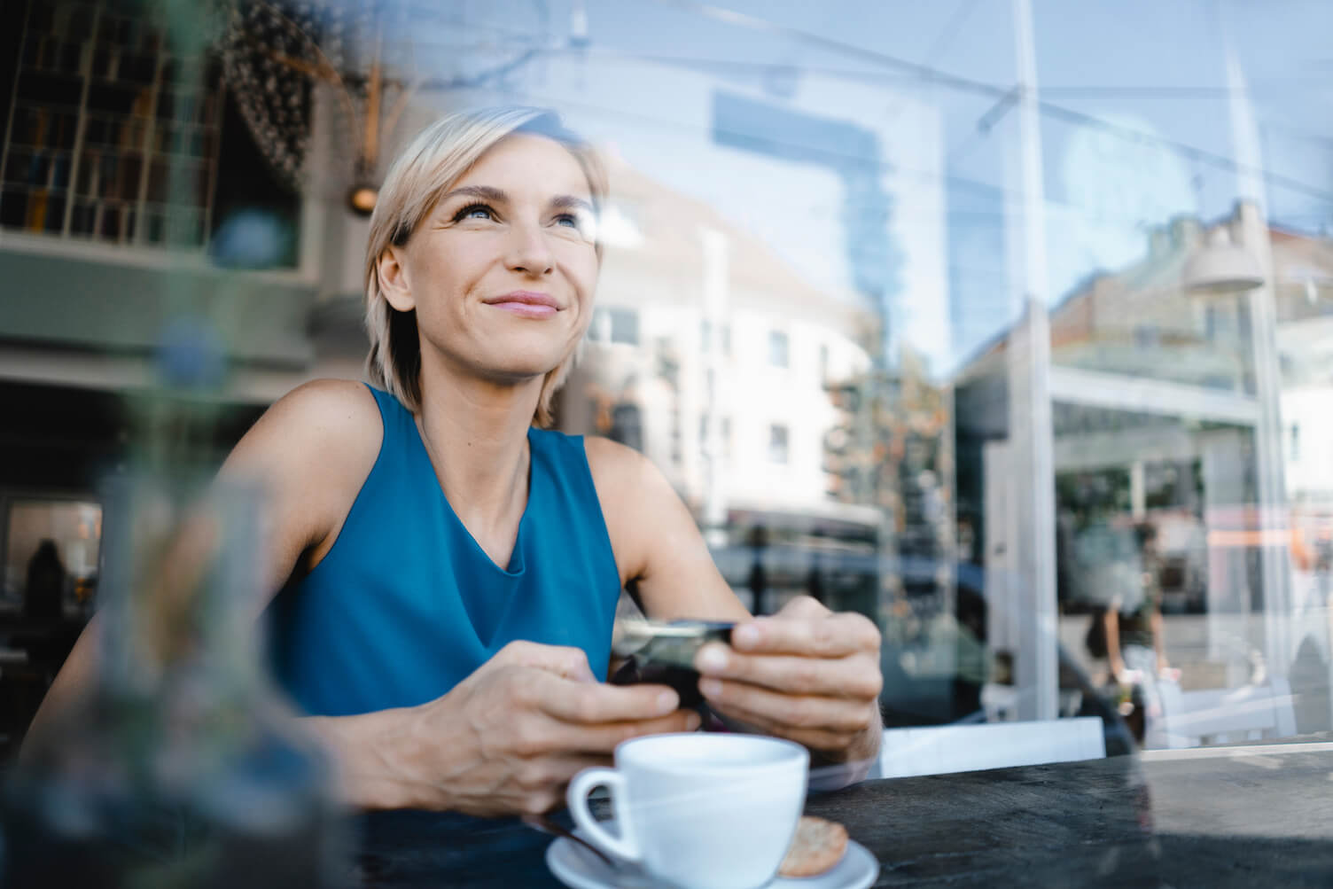 Woman sat in a cafe