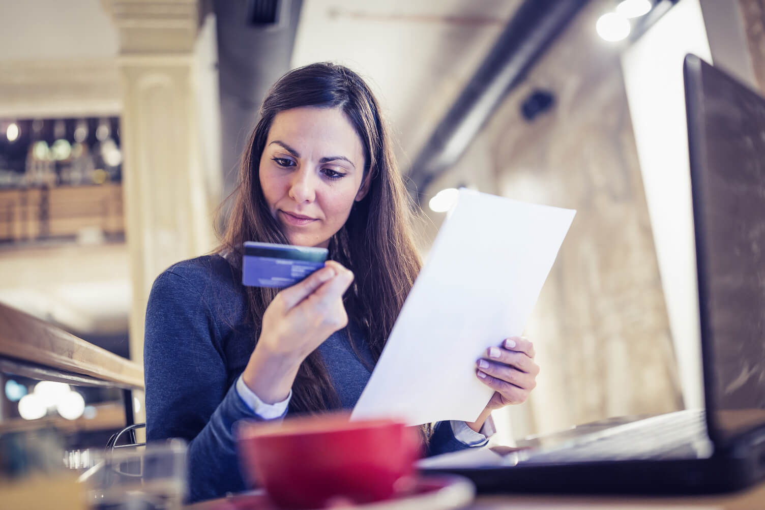 Woman checking her credit card