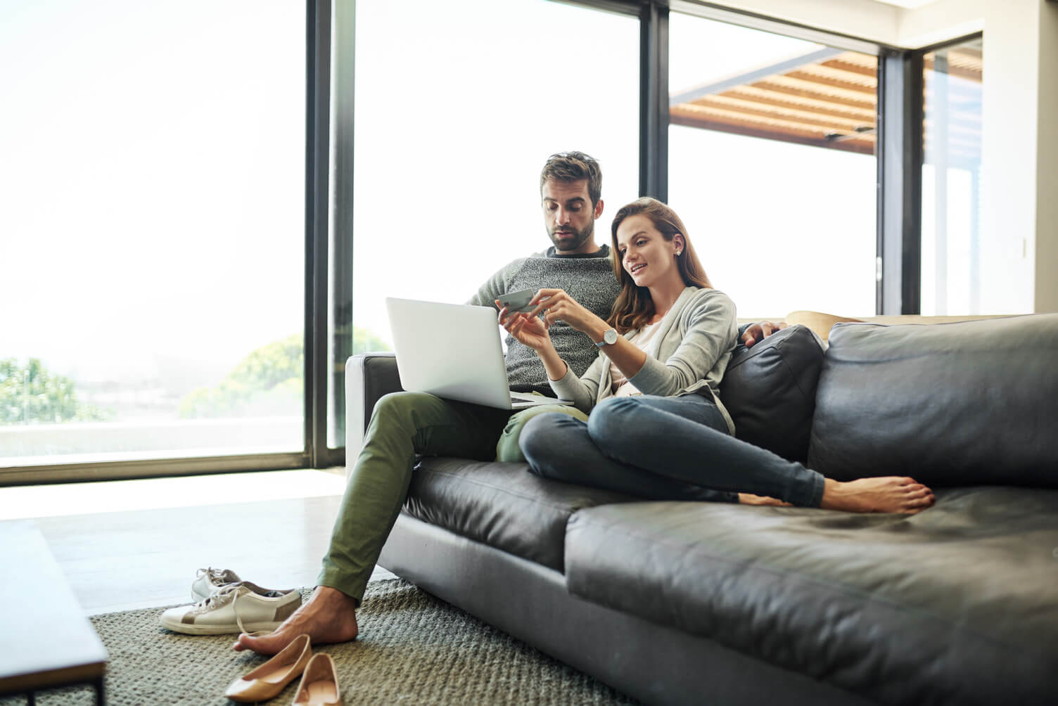 Couple on sofa at laptop