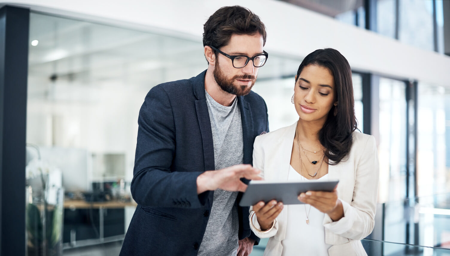 Two colleagues at a small business reviewing data