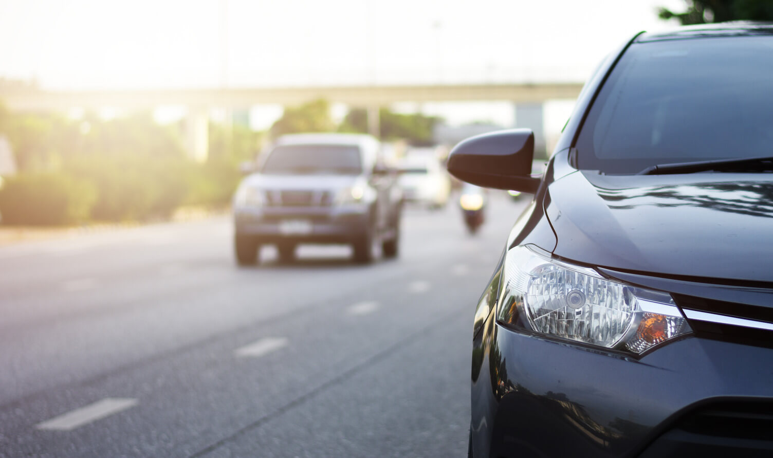 Cars driving along a road