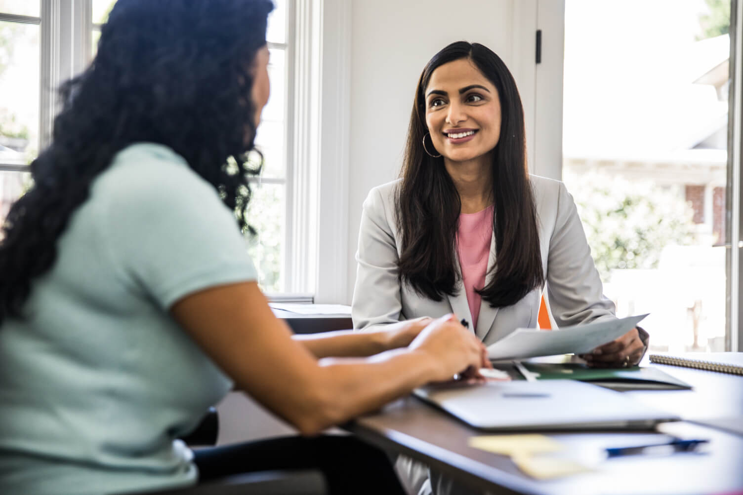 Woman checking workplace identity documents