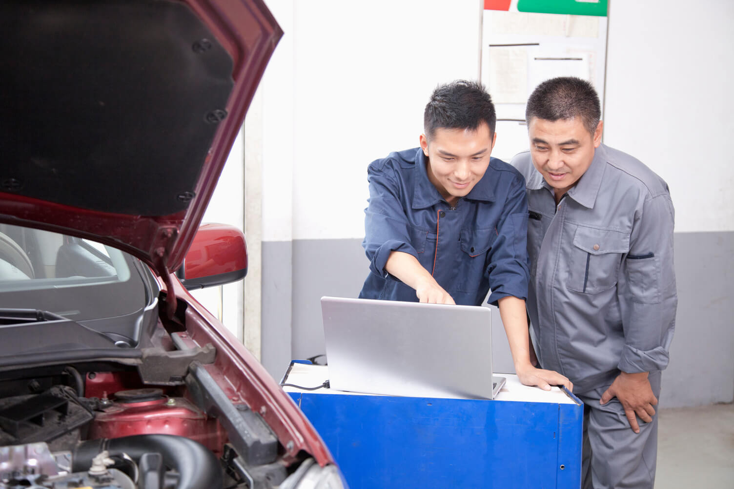 Two employees looking at a computer