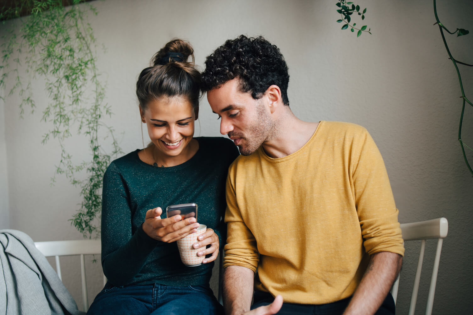 Young couple looking at a mobile phone