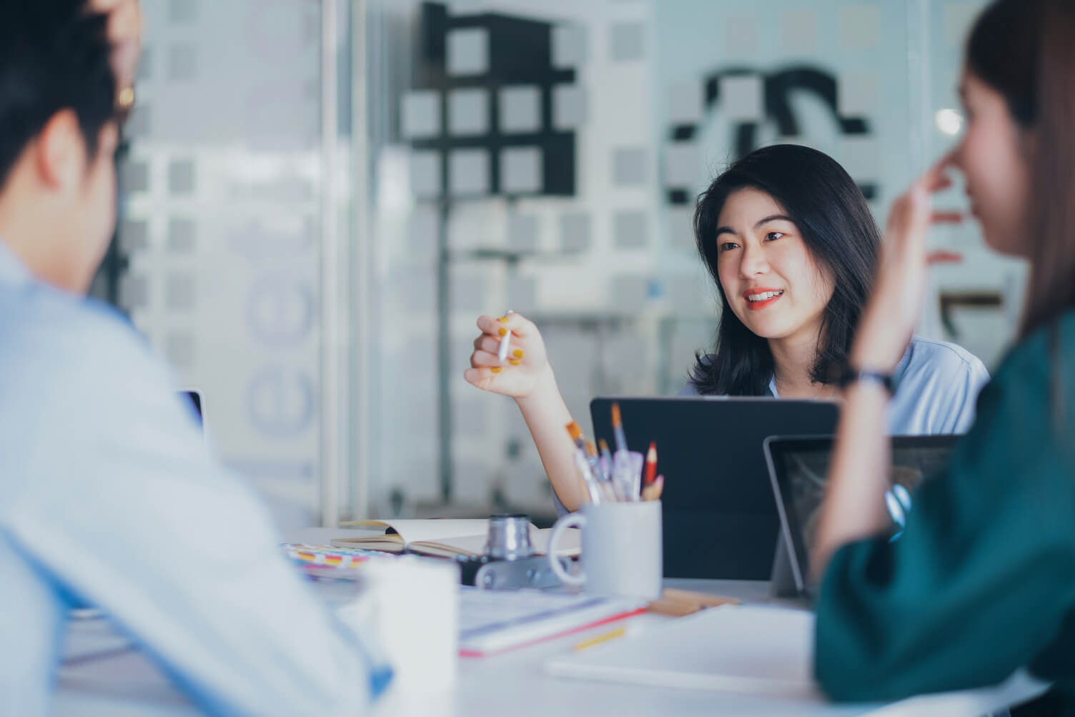 Businesswoman talking her colleagues through data