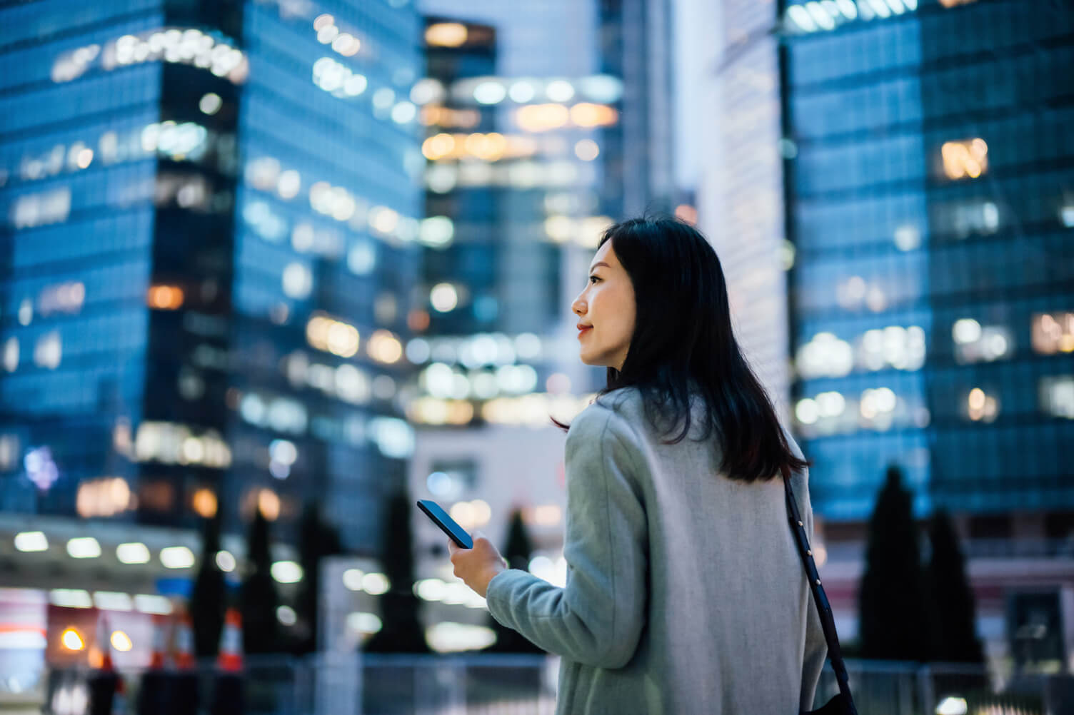 International woman looking at her phone