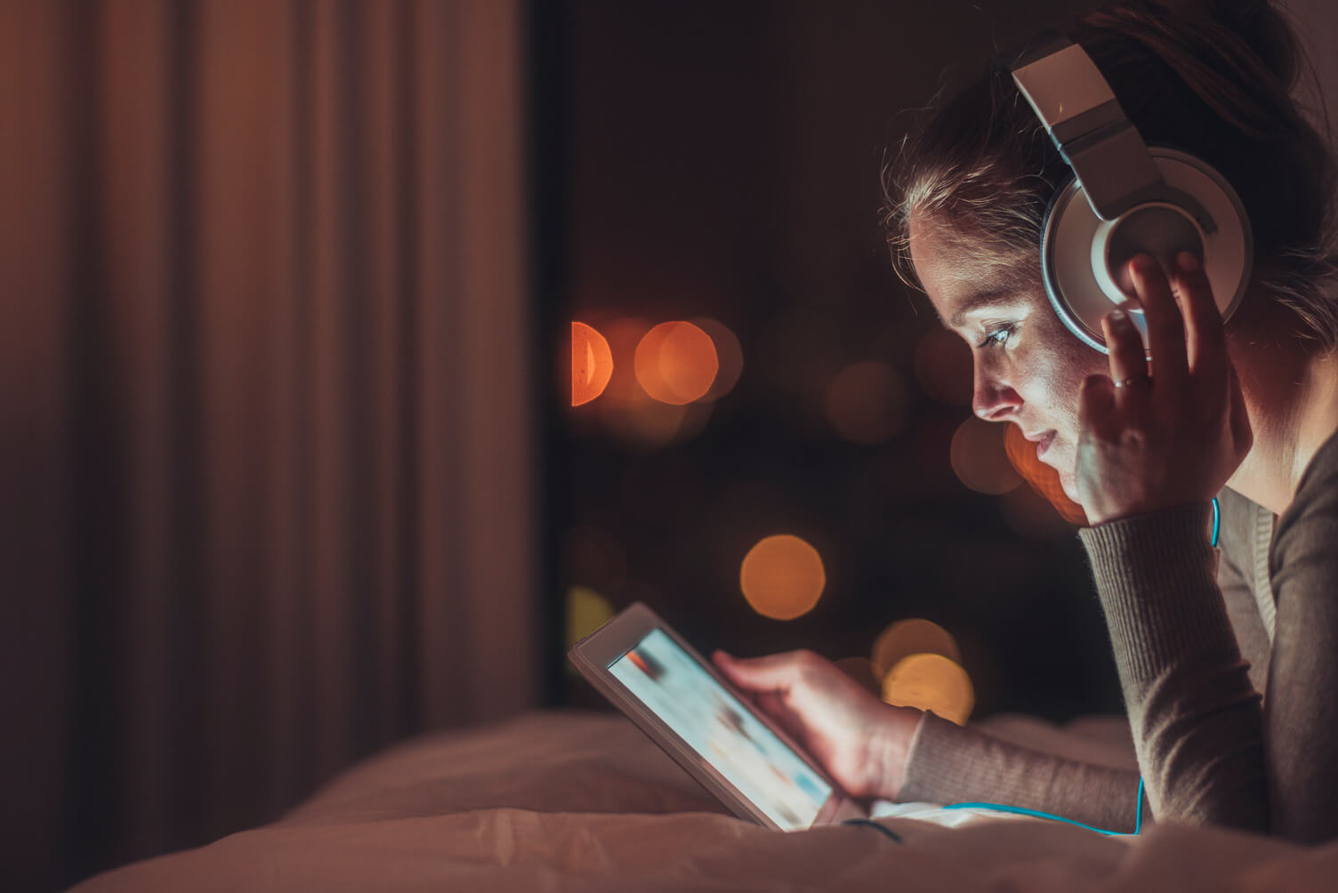 A woman listening to music while on her phone