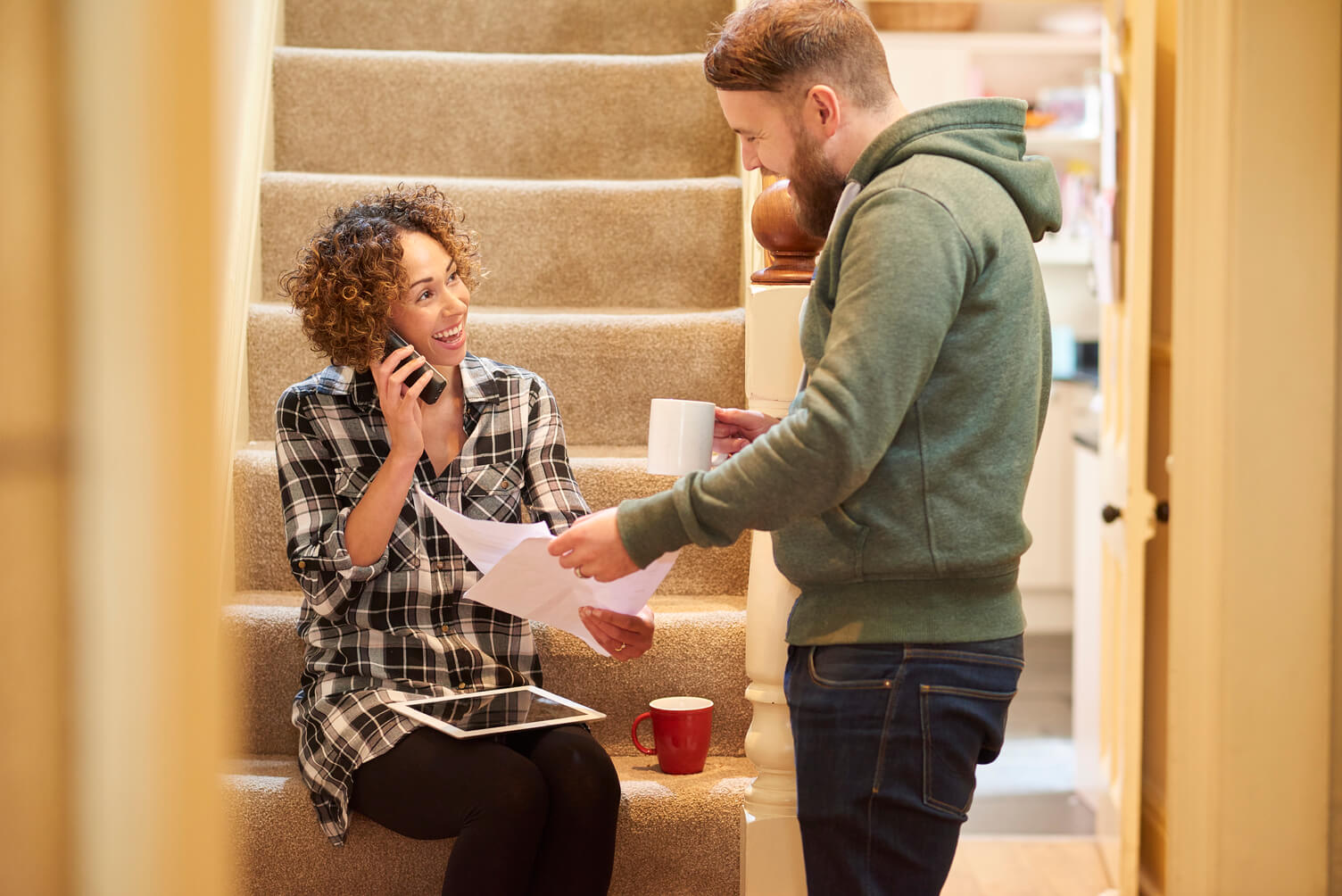 Couple opening a letter