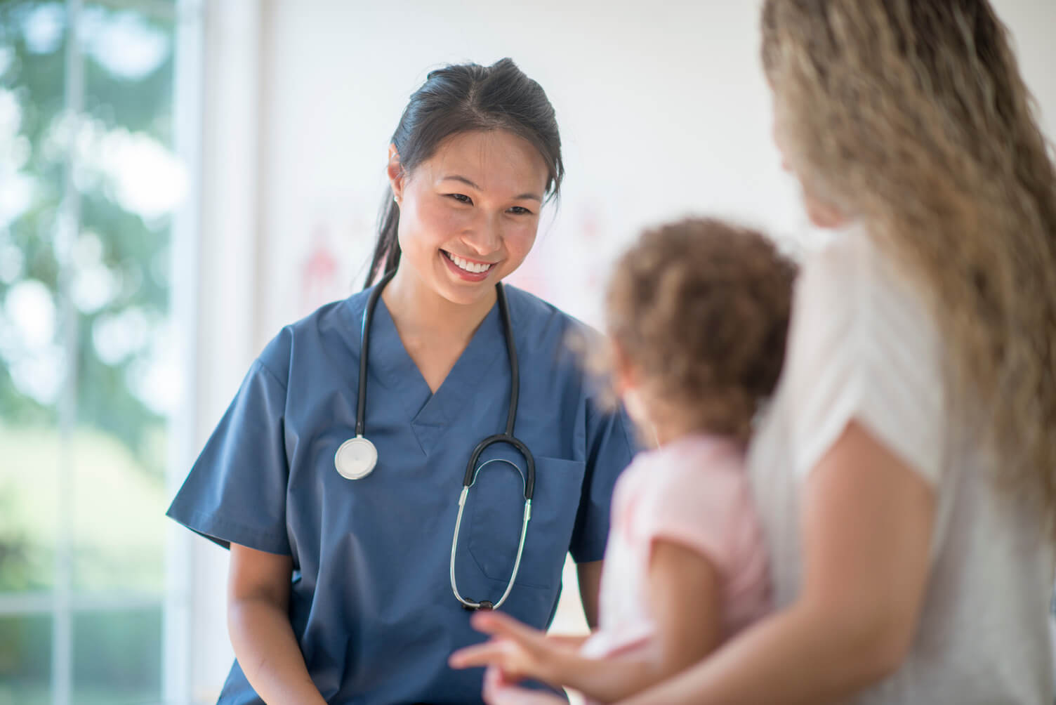 A doctor helping a young patient