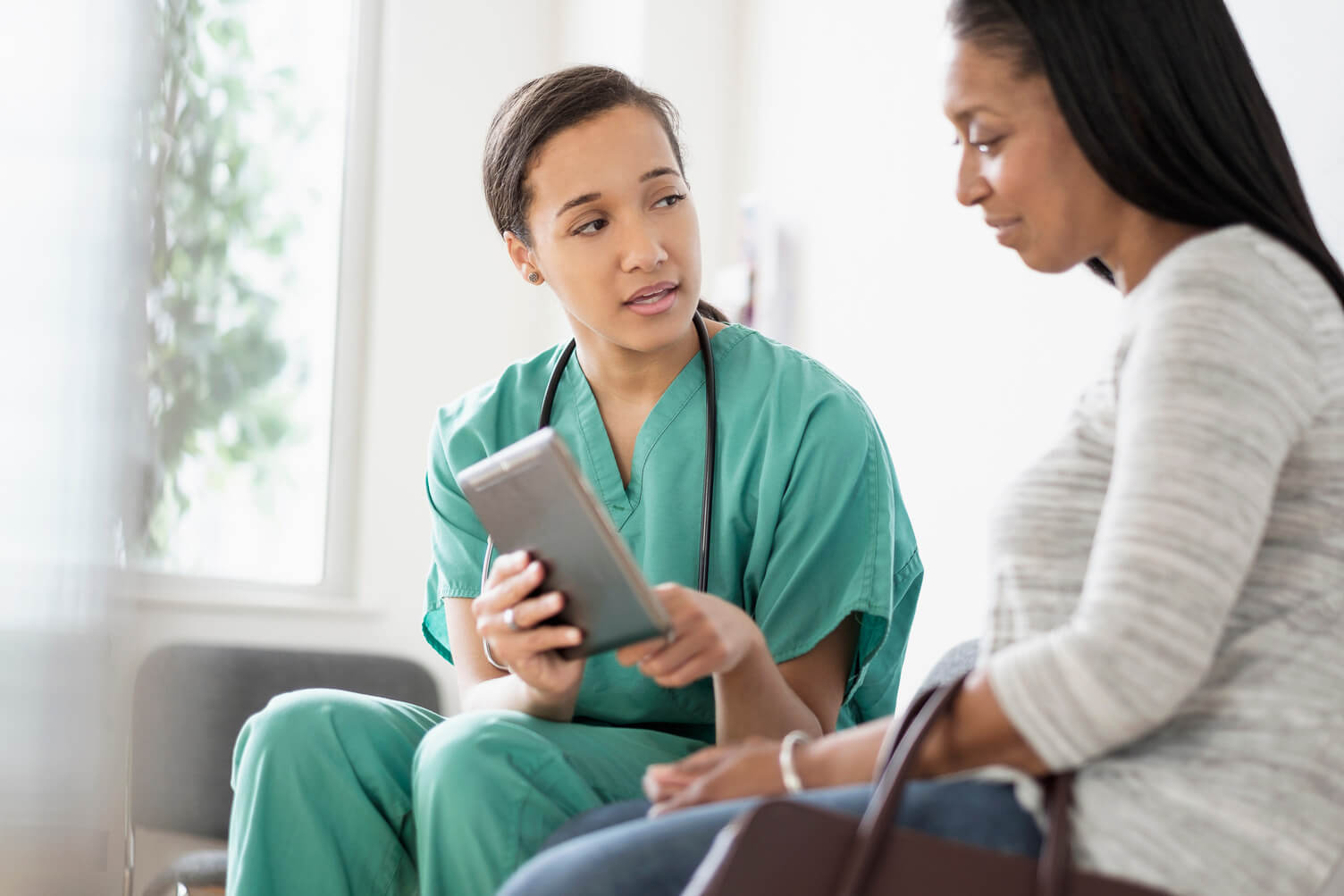 A consultant talking to a patient