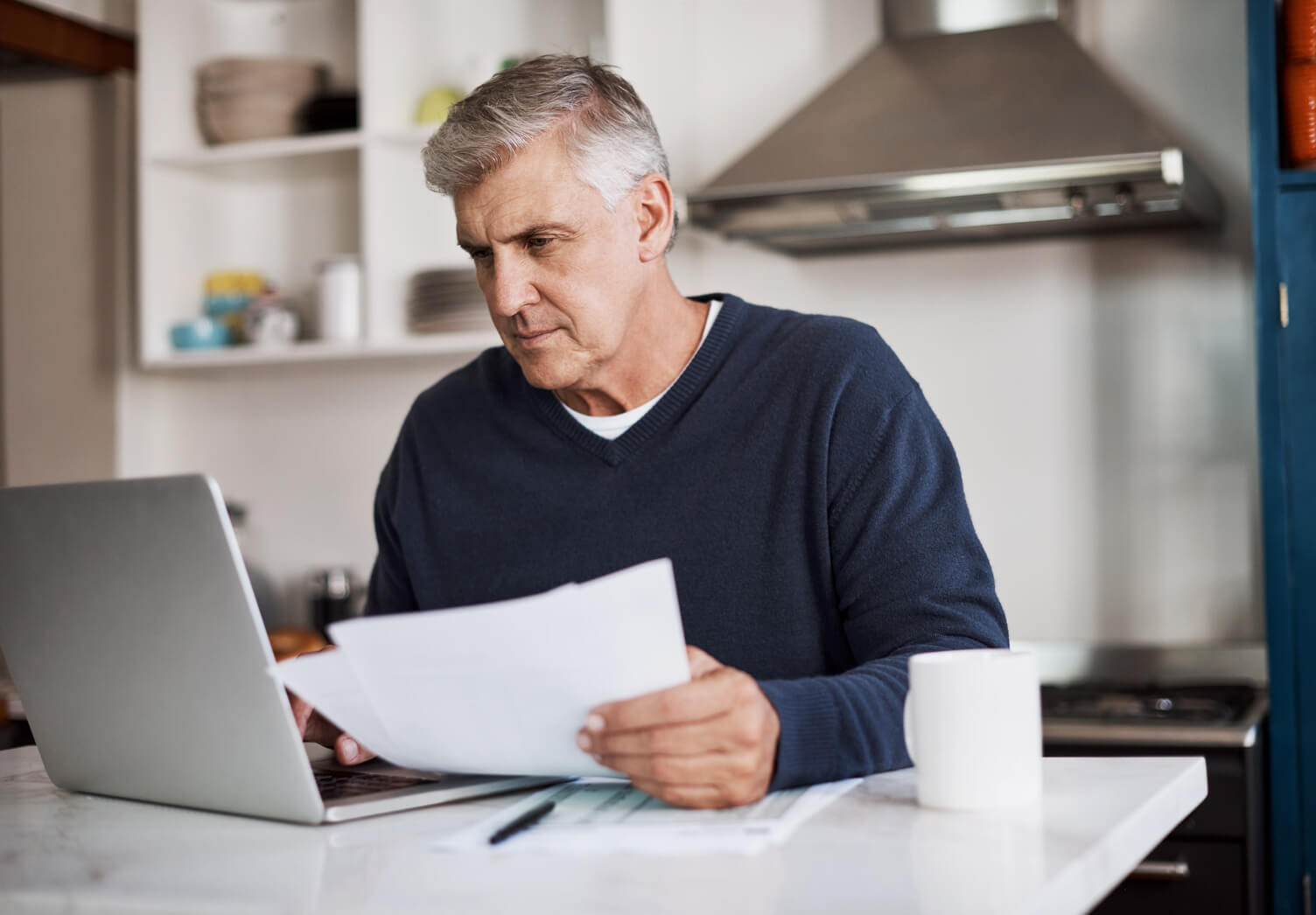 Man looking through his bills