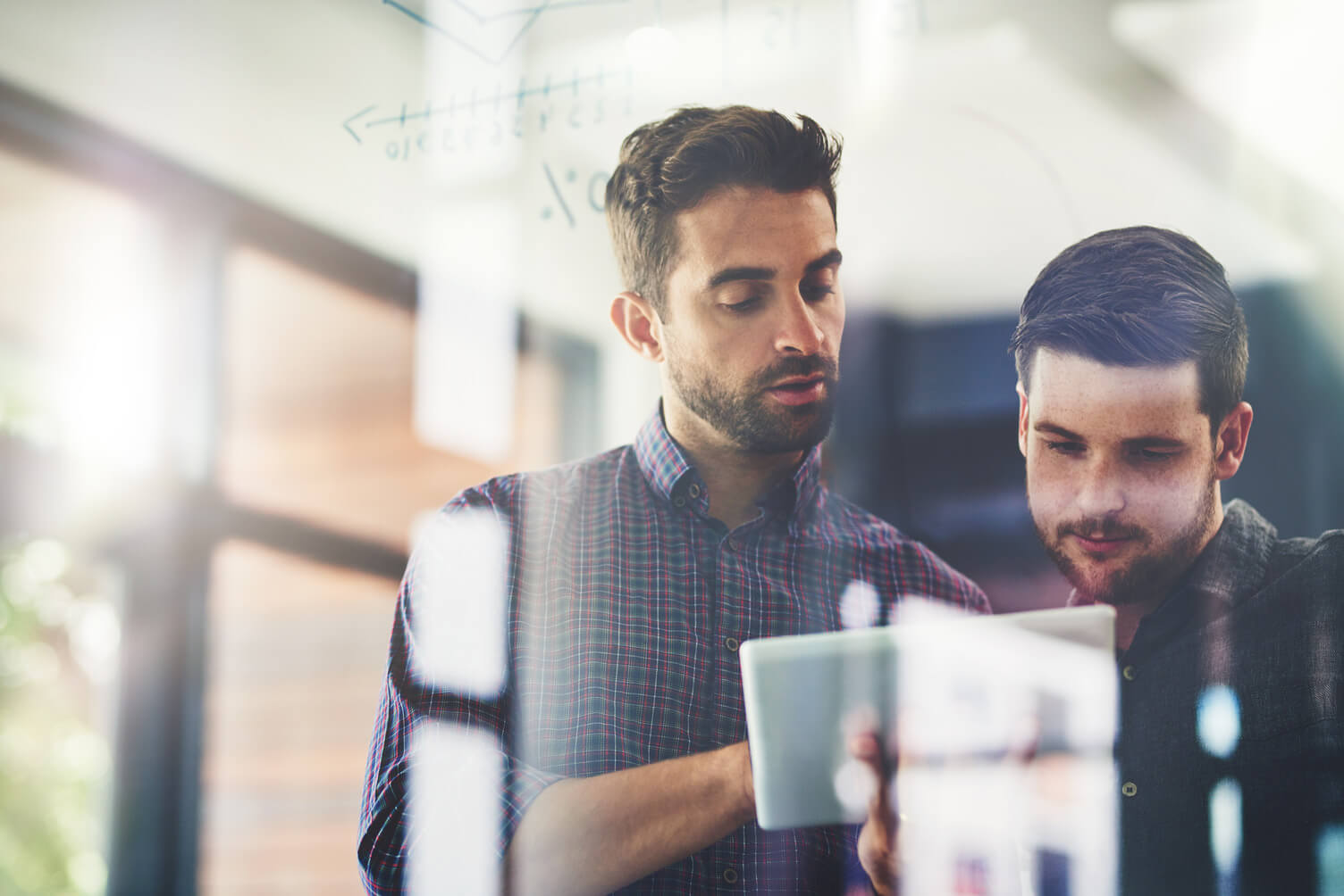 Two men discussing data