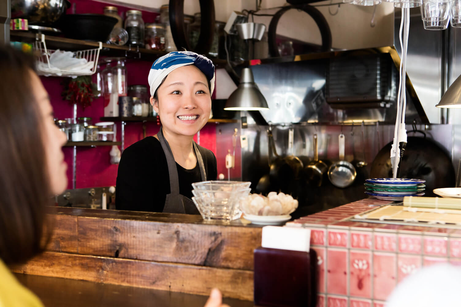 Barista smiling at customers