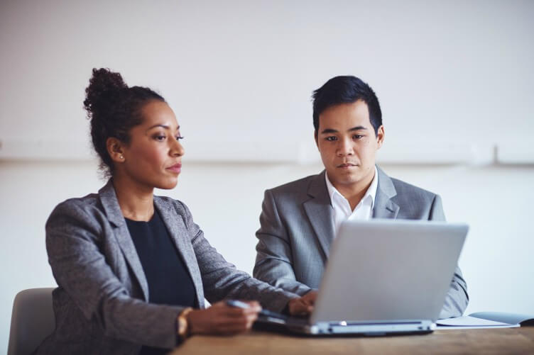 Business colleagues discussing their AML policy