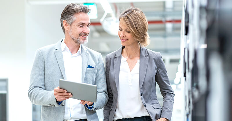 Two colleagues talking in an office