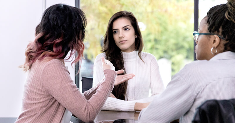 Ladies meeting around an office table