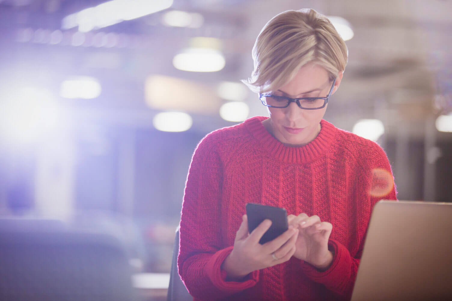 Woman looking at her credit score on her mobile phone