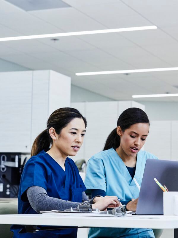 Medical workers looking at patient records