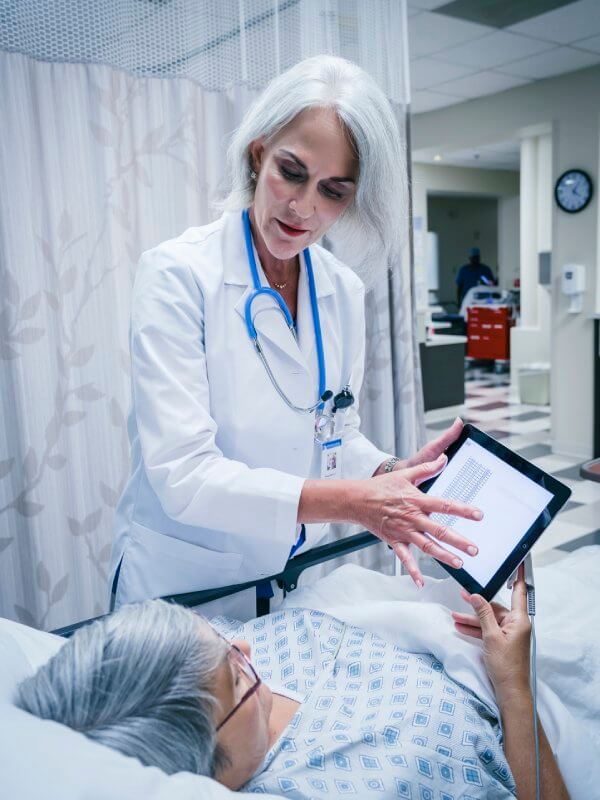 A consultant showing a patient their notes