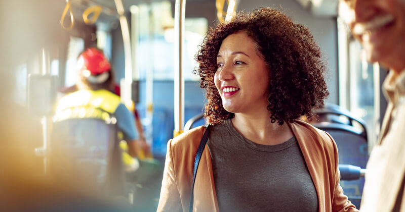 Woman smiling while on public transport