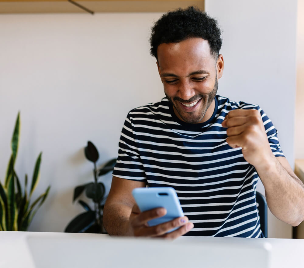 Man using his mobile phone for online gaming