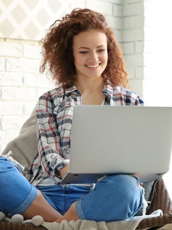 Woman smiling while making purchases online