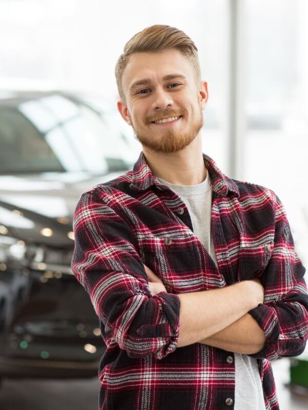 New car customer looking happy with their purchase