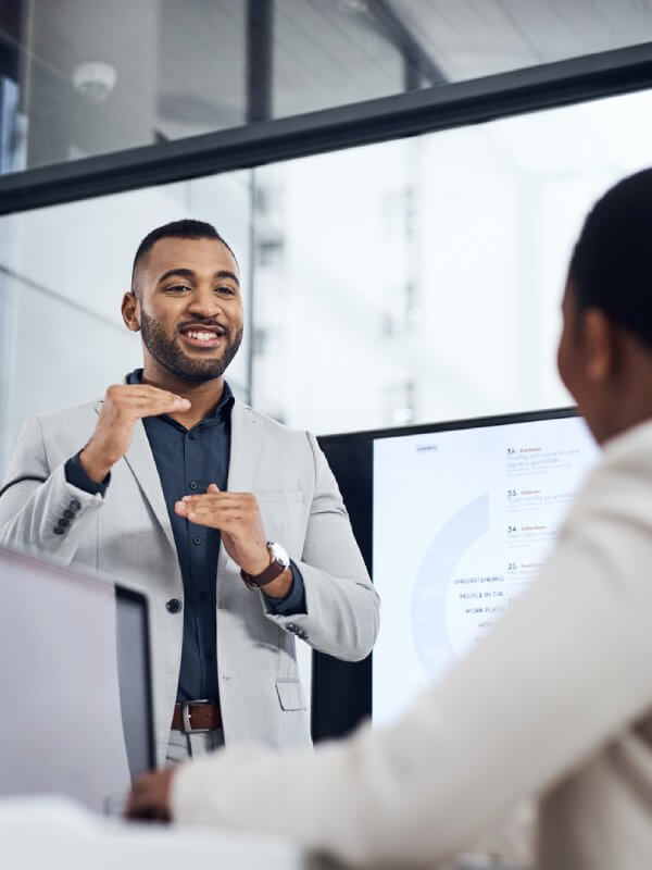 Two colleagues discussing trends in the credit market