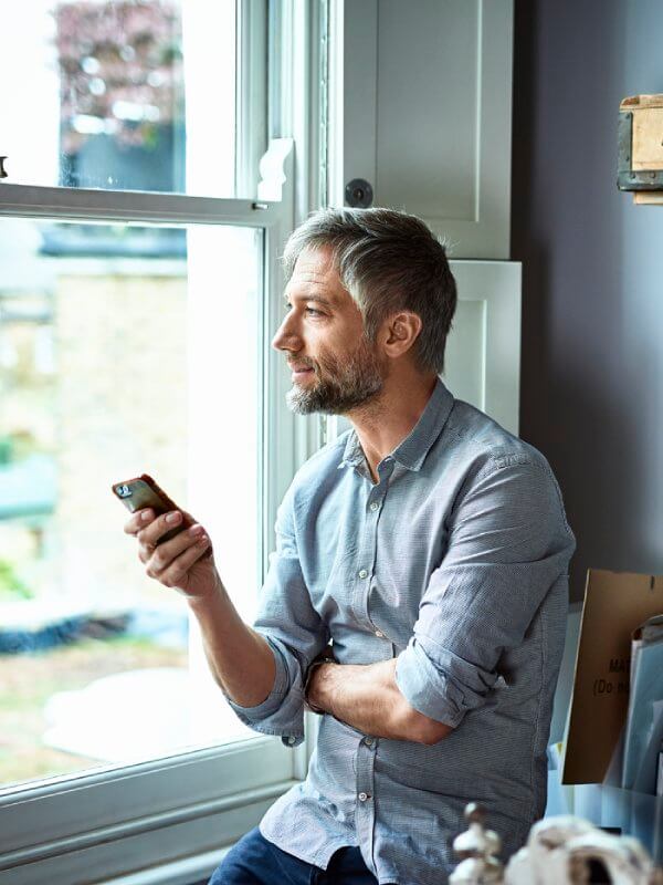 Man taking a phone call on loudspeaker