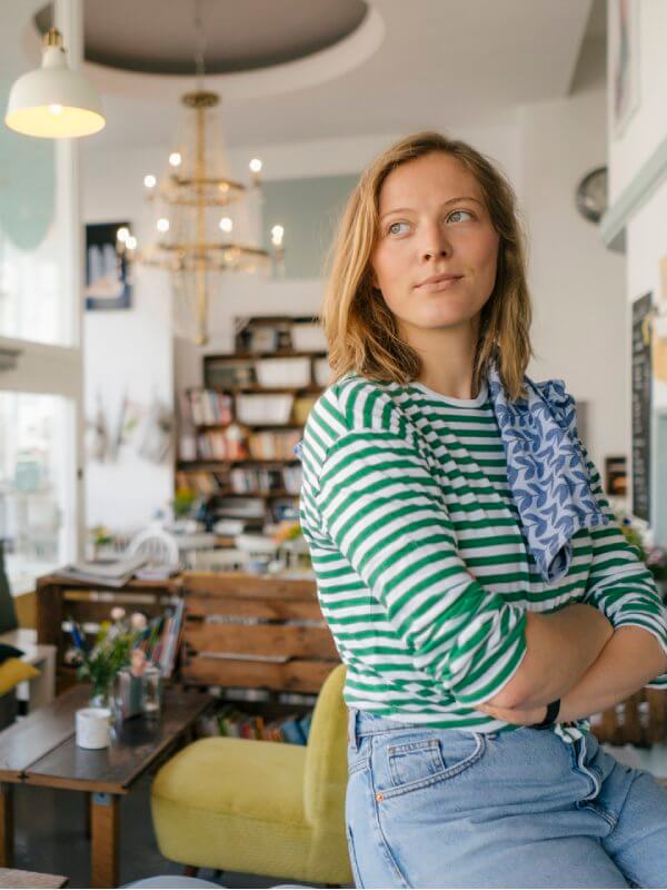 Coffee shop owner looking across the store