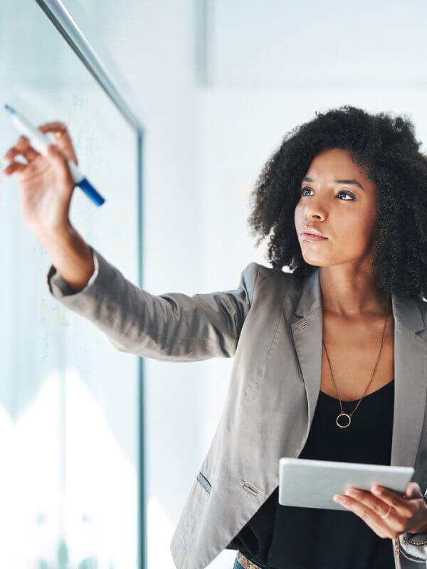 Young woman in an office assessing her customer lifecycle