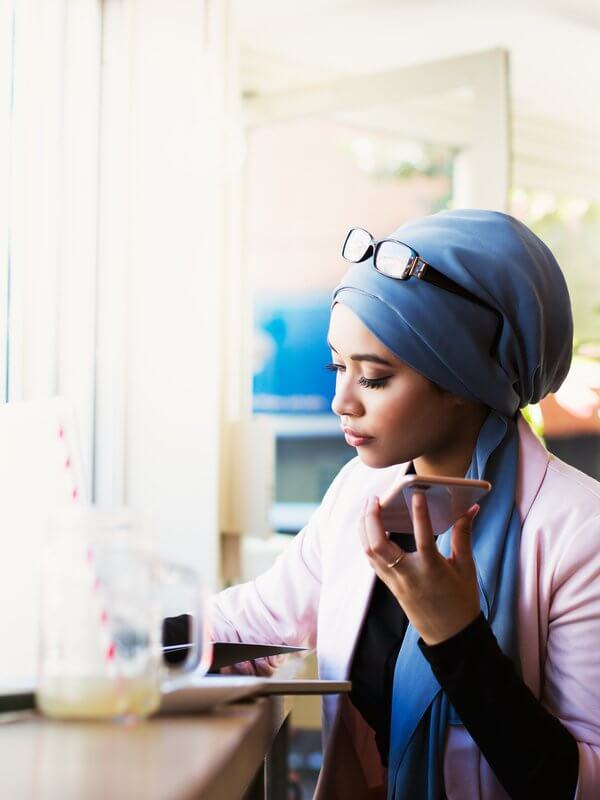 Woman taking a call in a coffee shop