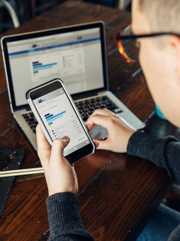 Man looking at a financial balance on his mobile phone