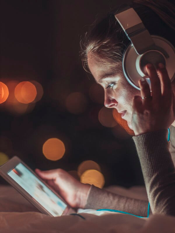 Young woman watching videos on a tablet