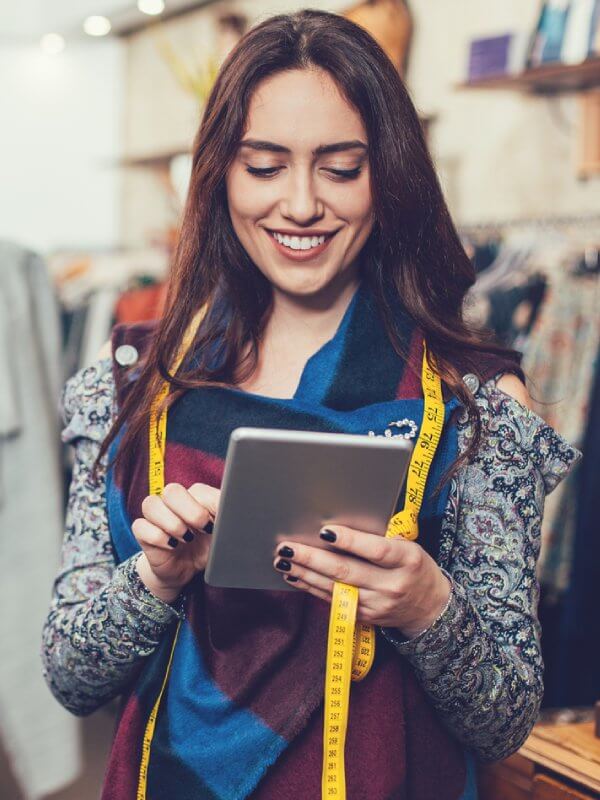 Businesswoman using her tablet to update her strategies