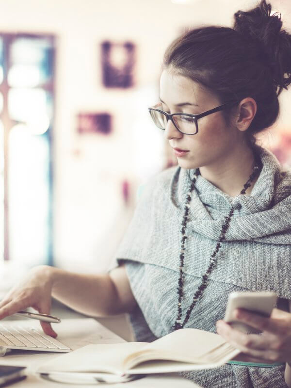 Woman browsing through papers and accounts